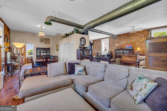 1 Public Sq, Bowman, GA 30624 - living room with brick wall, wood finished floors, and a ceiling fan