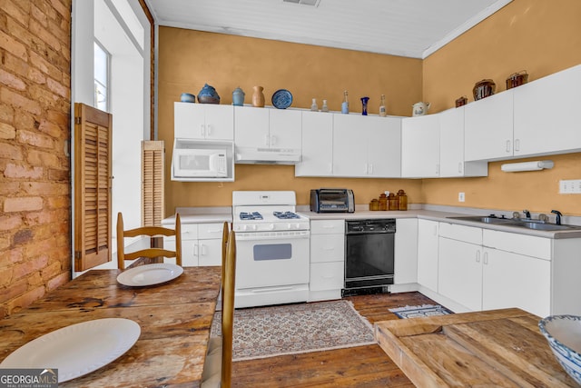1 Public Sq, Bowman, GA 30624 - kitchen with white appliances, under cabinet range hood, a sink, dark wood-style flooring, and white cabinetry