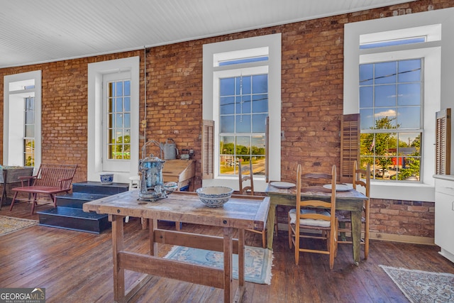 1 Public Sq, Bowman, GA 30624 - dining space with brick wall, wood-type flooring, and plenty of natural light