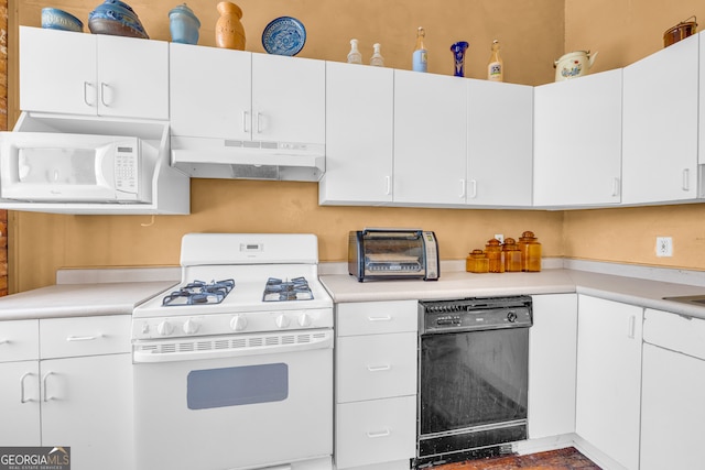 1 Public Sq, Bowman, GA 30624 - kitchen with under cabinet range hood, white appliances, and light countertops