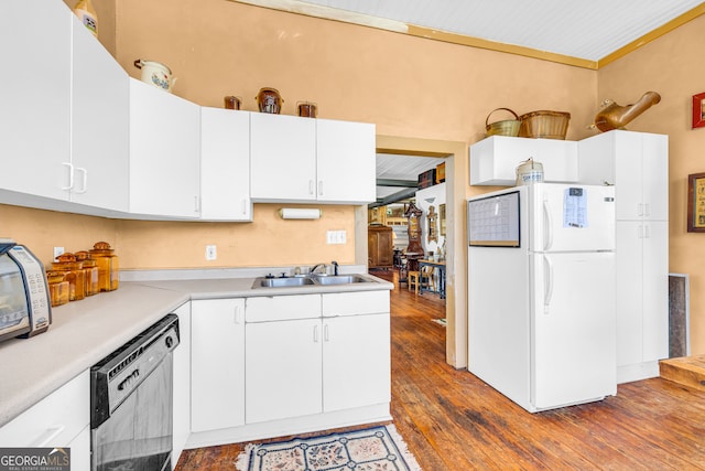 1 Public Sq, Bowman, GA 30624 - kitchen featuring freestanding refrigerator, black dishwasher, a sink, light countertops, and wood-type flooring