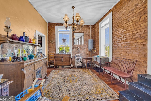 1 Public Sq, Bowman, GA 30624 - sitting room with healthy amount of natural light, brick wall, hardwood / wood-style flooring, and a chandelier