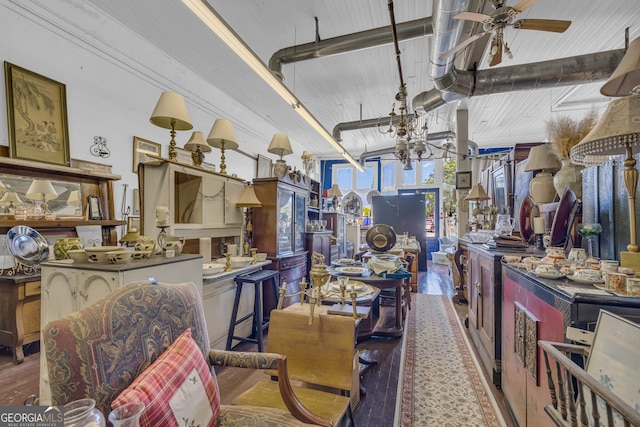 1 Public Sq, Bowman, GA 30624 - dining room with wood finished floors, a ceiling fan, and a chandelier