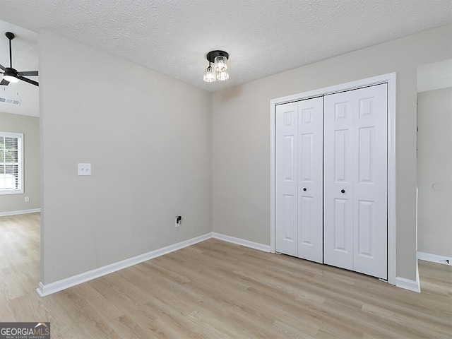 201 Twin Pines Ct, Dallas, GA 30132 - unfurnished bedroom featuring light wood-type flooring, baseboards, and a closet