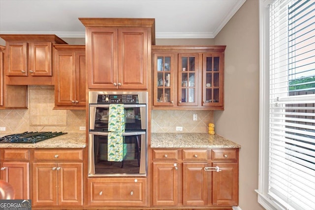5000 Davenport Pl, Roswell, GA 30075 - kitchen featuring stainless steel double oven, gas stovetop, light stone countertops, glass insert cabinets, and brown cabinetry