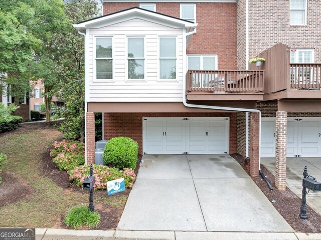 5000 Davenport Pl, Roswell, GA 30075 - view of front of property with an attached garage, concrete driveway, and brick siding
