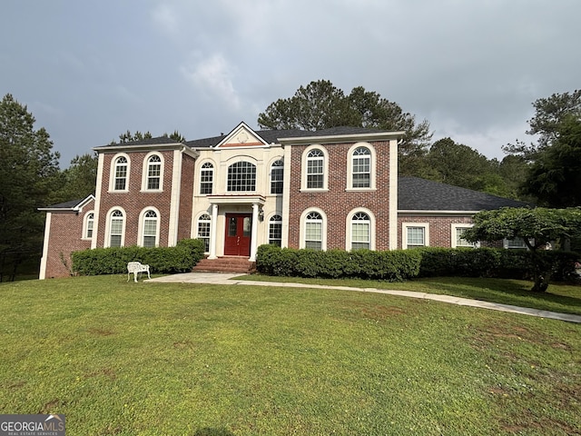 5452 Old Dalton Rd, Calhoun, GA 30701 - colonial house featuring a front yard and brick siding