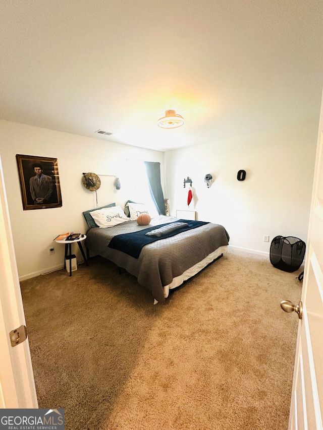 bedroom with carpet and baseboards