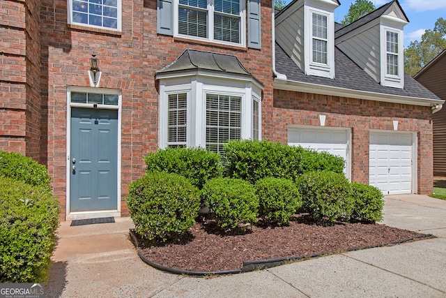 4535 Howell Farms Rd NW, Acworth, GA 30101 - property entrance featuring driveway, brick siding, and roof with shingles