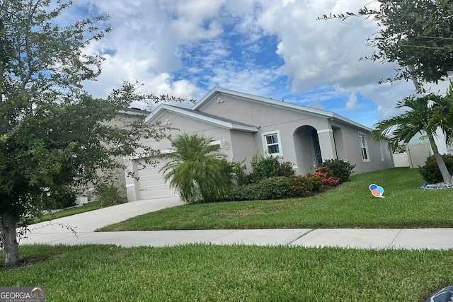single story home featuring stucco siding, a garage, and concrete driveway