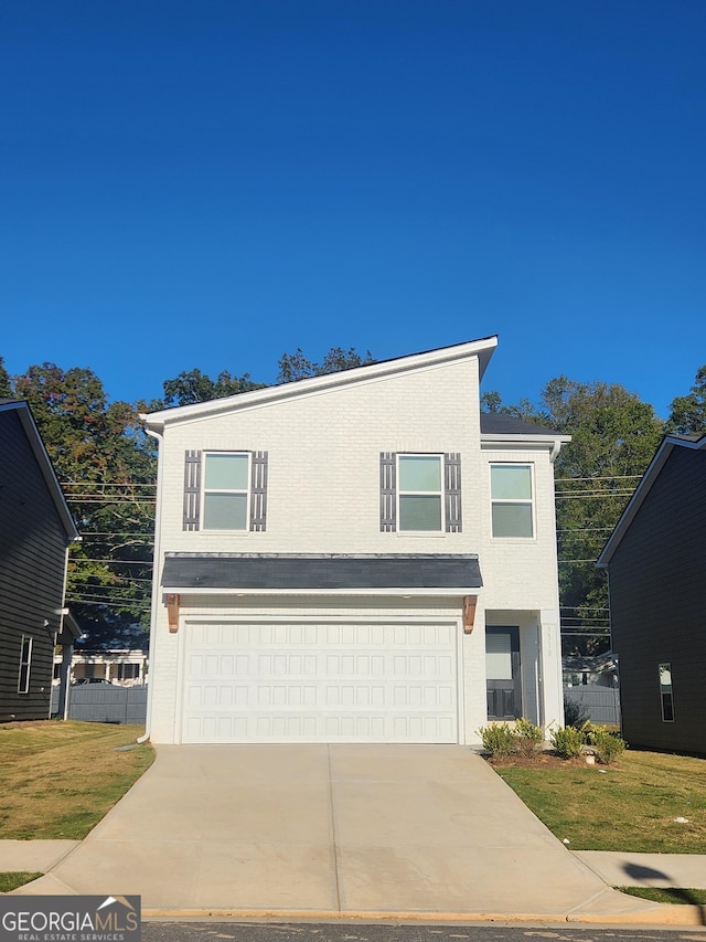 view of front of home featuring a garage, concrete driveway, and brick siding