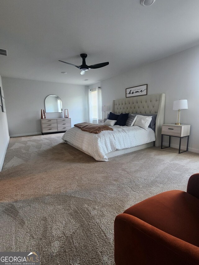bedroom featuring carpet flooring, baseboards, and a ceiling fan