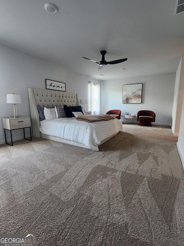 carpeted bedroom featuring a ceiling fan and baseboards