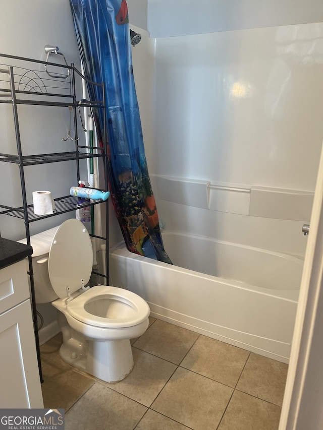 20 Marietta St NW Unit 10F, Atlanta, GA 30303 - bathroom with toilet, shower / bathtub combination with curtain, tile patterned floors, and vanity
