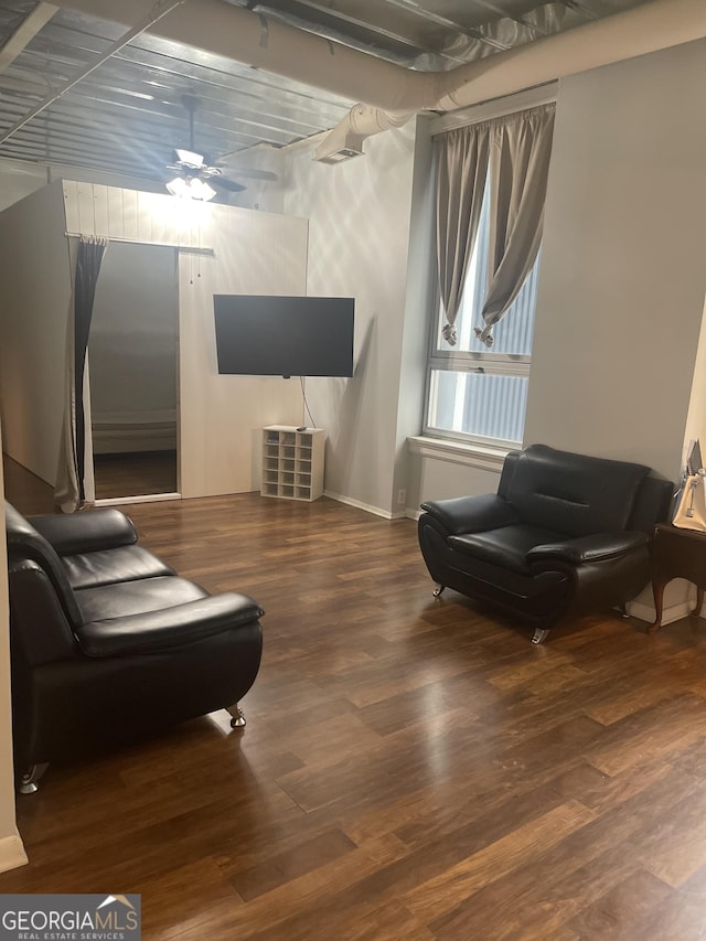 20 Marietta St NW Unit 10F, Atlanta, GA 30303 - living area with wood finished floors, baseboards, and a ceiling fan
