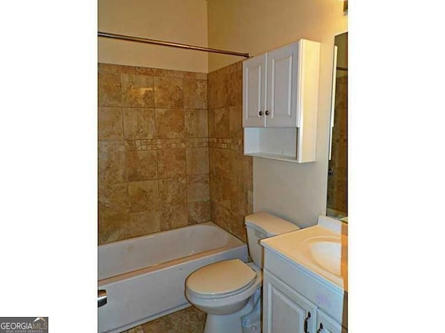 bathroom featuring vanity, toilet, and shower / bathtub combination