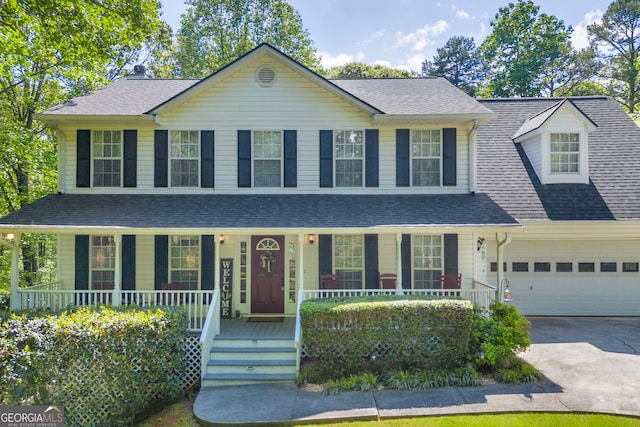 1886 Bend N Hickory Rd, Toccoa, GA 30577 - view of front of house with covered porch, concrete driveway, an attached garage, and roof with shingles