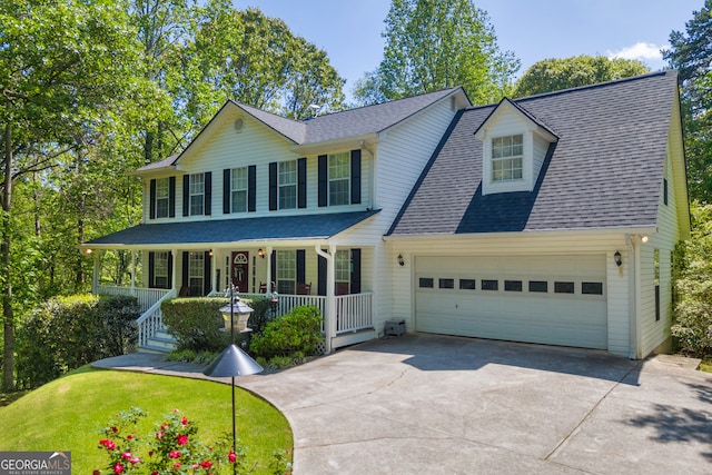 1886 Bend N Hickory Rd, Toccoa, GA 30577 - view of front facade with a porch, a garage, concrete driveway, roof with shingles, and a front lawn