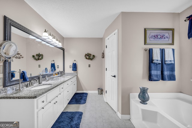1886 Bend N Hickory Rd, Toccoa, GA 30577 - full bathroom with baseboards, a bath, double vanity, and a textured ceiling