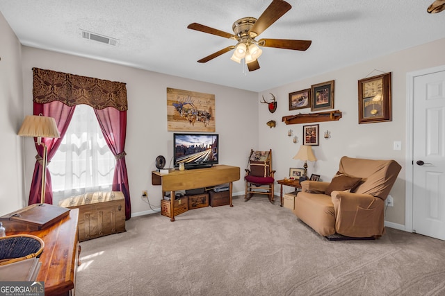 1886 Bend N Hickory Rd, Toccoa, GA 30577 - living area featuring ceiling fan, carpet floors, a textured ceiling, and baseboards