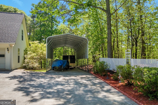 1886 Bend N Hickory Rd, Toccoa, GA 30577 - view of vehicle parking featuring a carport, driveway, and fence
