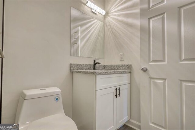3959 Wood Path Dr, Stone Mountain, GA 30083 - half bathroom with vanity and toilet