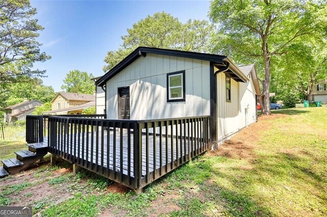 3959 Wood Path Dr, Stone Mountain, GA 30083 - back of property featuring a wooden deck and a yard