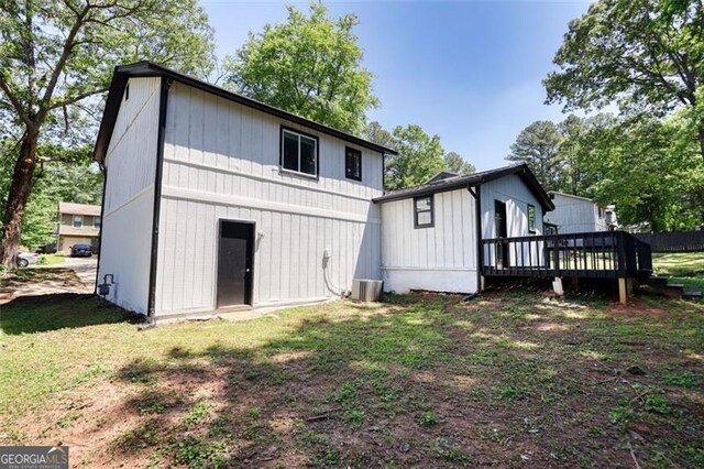 3959 Wood Path Dr, Stone Mountain, GA 30083 - rear view of property with a wooden deck and a yard