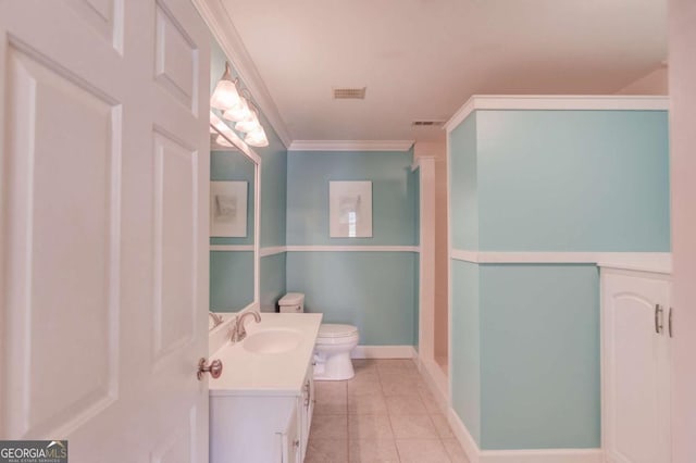 1608 Mulberry Lake Dr, Dacula, GA 30019 - bathroom with toilet, vanity, ornamental molding, tile patterned flooring, and baseboards