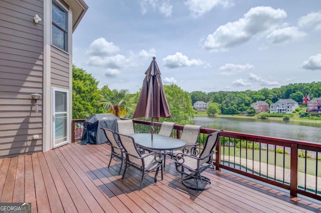 1608 Mulberry Lake Dr, Dacula, GA 30019 - deck featuring a water view, area for grilling, outdoor dining space, and view of scattered trees