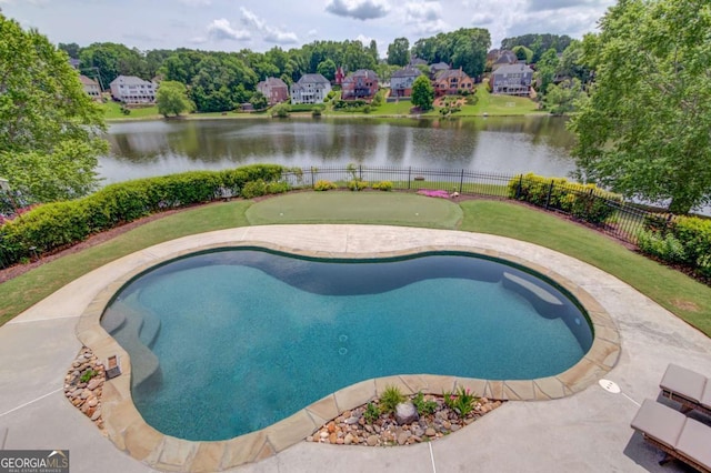 1608 Mulberry Lake Dr, Dacula, GA 30019 - view of pool with an area to practice putting, fence, and a water view