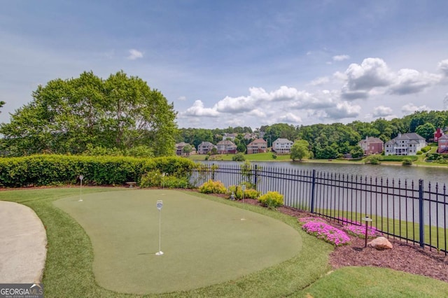 1608 Mulberry Lake Dr, Dacula, GA 30019 - view of property's community with a putting area, fence, and a water view