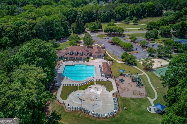 1608 Mulberry Lake Dr, Dacula, GA 30019 - aerial view of property and surrounding area with a pool and a forest