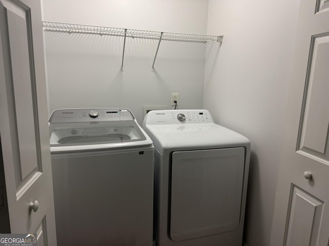 washroom with washer and dryer