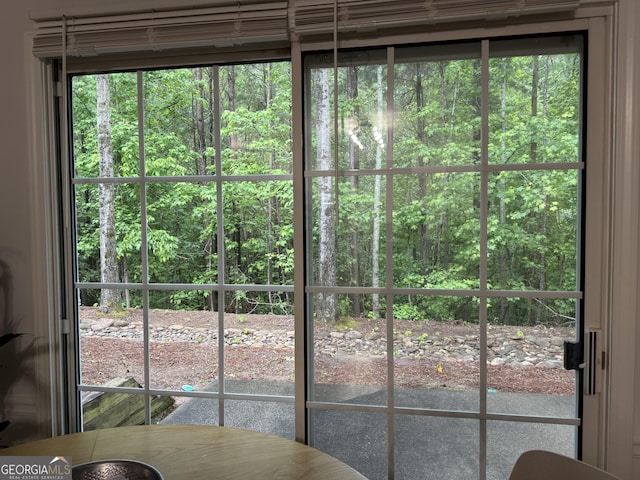 doorway to outside with a view of trees