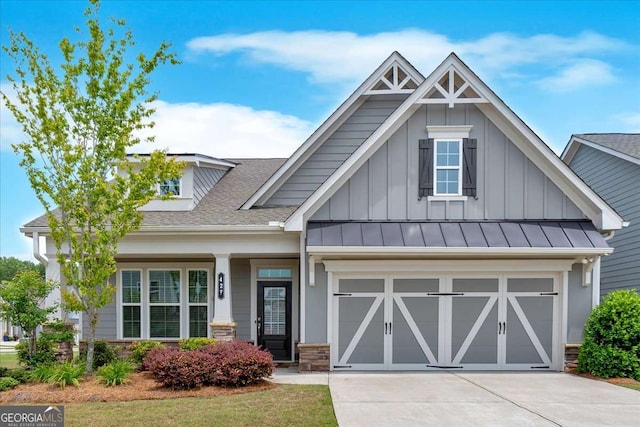 427 Bluffs View Ln, Canton, GA 30114 - craftsman-style home featuring board and batten siding, driveway, a shingled roof, and a garage