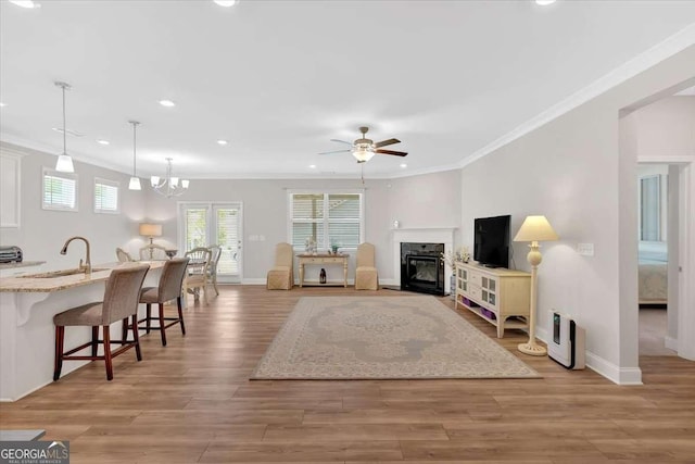 427 Bluffs View Ln, Canton, GA 30114 - living area with ceiling fan, crown molding, recessed lighting, baseboards, and a fireplace with flush hearth