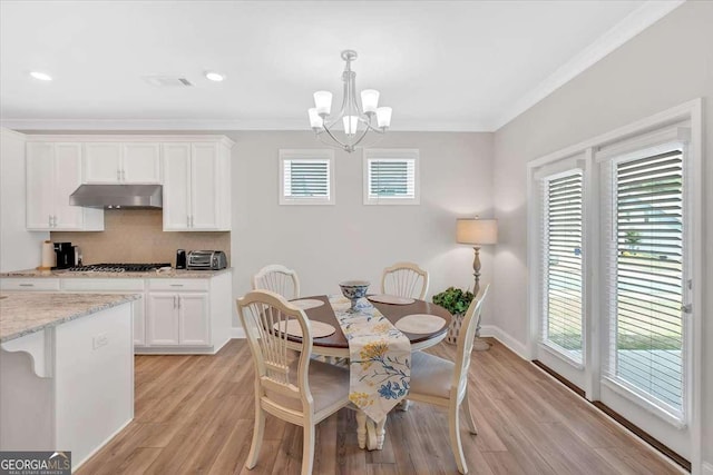 427 Bluffs View Ln, Canton, GA 30114 - dining space with a chandelier, light wood-style flooring, crown molding, baseboards, and recessed lighting