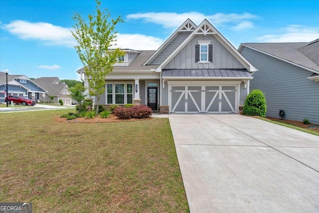 427 Bluffs View Ln, Canton, GA 30114 - craftsman-style home with board and batten siding, driveway, a front yard, and stone siding