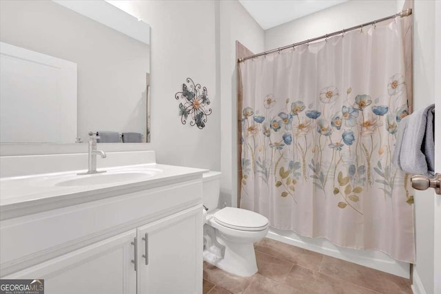 427 Bluffs View Ln, Canton, GA 30114 - full bathroom with vanity, toilet, tile patterned floors, and shower / tub combo with curtain