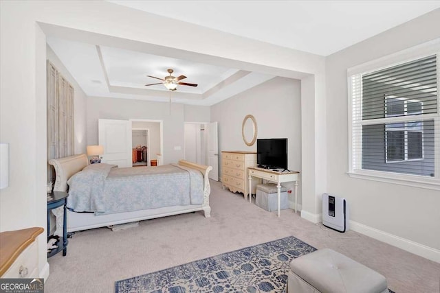 427 Bluffs View Ln, Canton, GA 30114 - bedroom with carpet floors, a tray ceiling, baseboards, and ceiling fan
