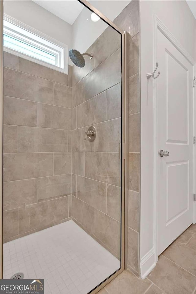 427 Bluffs View Ln, Canton, GA 30114 - bathroom with a shower stall and tile patterned flooring
