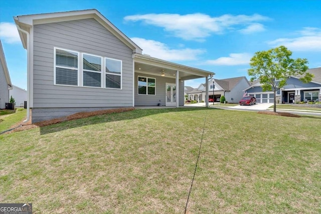427 Bluffs View Ln, Canton, GA 30114 - rear view of property with a yard and central AC