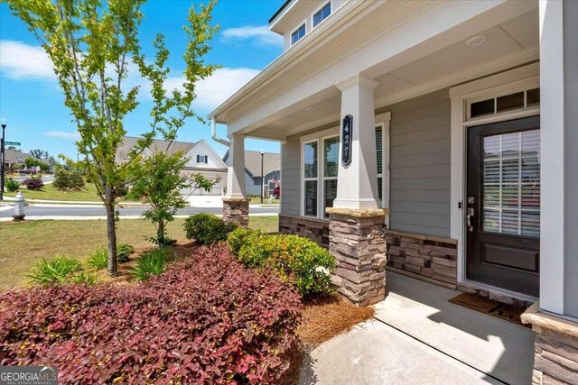 427 Bluffs View Ln, Canton, GA 30114 - entrance to property featuring stone siding and covered porch