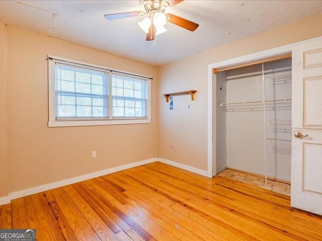 219 Briarwood Dr, Dallas, GA 30132 - unfurnished bedroom with a closet, light wood finished floors, and ceiling fan