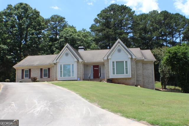 1311 N Brandy Shls, Conyers, GA 30013 - ranch-style house with brick siding, a front lawn, and a chimney