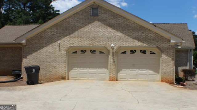 1311 N Brandy Shls, Conyers, GA 30013 - garage featuring driveway