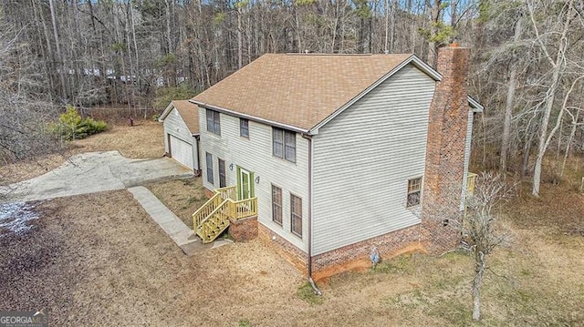 1791 Lake George Dr, Lithia Springs, GA 30122 - view of side of property with a chimney and a garage
