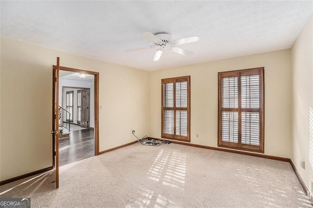 1791 Lake George Dr, Lithia Springs, GA 30122 - empty room with carpet, baseboards, and ceiling fan