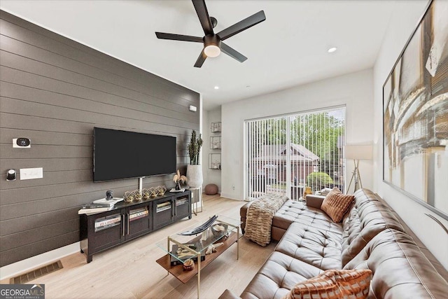 701 Pryor St SW # 5, Atlanta, GA 30315 - living area featuring ceiling fan, light wood finished floors, wooden walls, and recessed lighting